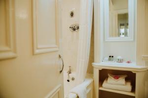 a bathroom with a shower and a sink at Cashel House Hotel in Roundstone