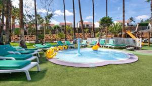 a pool with chairs and a water park at Bull Eugenia Victoria & Spa in Playa del Ingles