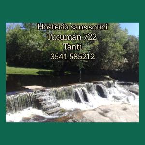 a picture of a waterfall with a sign that reads hosseinams soup t at Hosteria Sans Souci in Tanti