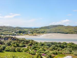 an aerial view of a beach and a body of water at 2 Tougal in Mallaig