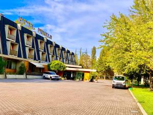 a hotel with two cars parked in front of it at Hotel Pamela in San Pietro in Casale