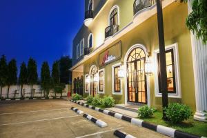 a store front of a building at night at A Villa Hua Hin Hotel in Hua Hin