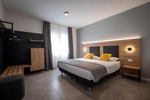 Un pat sau paturi într-o cameră la Appartamenti Tre Colline