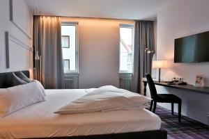 Postel nebo postele na pokoji v ubytování Hotel Schempp