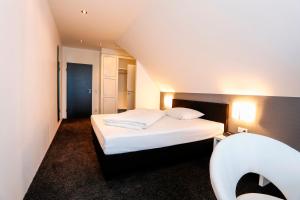 Postel nebo postele na pokoji v ubytování Hotel Schempp