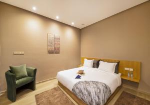Letto o letti in una camera di Palms Edge Villas avec Piscine & Jardin Privés