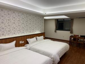 Voodi või voodid majutusasutuse Kin Shui Villa toas