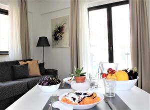 a living room with a table with a plate of food at Residence Pola in Catania