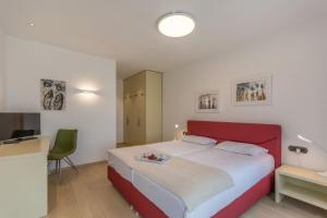 Postel nebo postele na pokoji v ubytování Villa Sara
