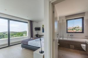 Postel nebo postele na pokoji v ubytování Villa Sara