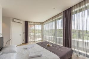 Postel nebo postele na pokoji v ubytování Villa Sara