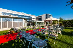 a group of tables and chairs in front of a building at Hotel Attica21 Las Rozas in Las Rozas de Madrid