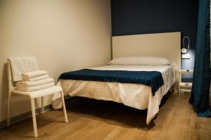 Postel nebo postele na pokoji v ubytování Hostal Mónaco