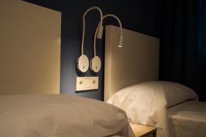 Postel nebo postele na pokoji v ubytování Hostal Mónaco