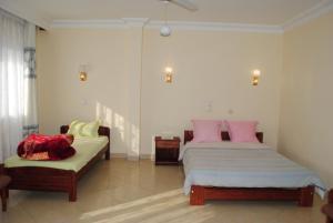 Ένα ή περισσότερα κρεβάτια σε δωμάτιο στο HOTEL MENABE