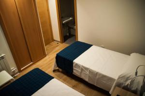 Postel nebo postele na pokoji v ubytování Hostal Mónaco