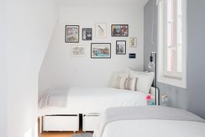 Uma cama ou camas num quarto em Mouzinho Rooftop View - Map House