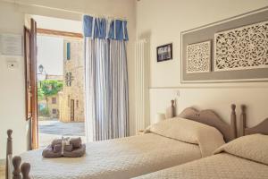 A bed or beds in a room at La Lanciotta