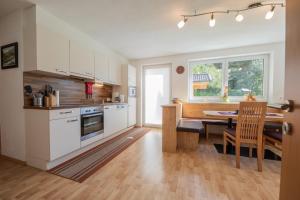 a kitchen with a table and a dining room at Apartment Valentina in Neustift im Stubaital
