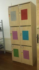 a locker with different colored doors in a room at Art Studio in Braşov