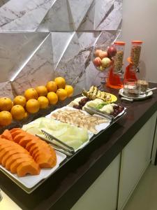 a buffet with many different types of food on a table at Hotel Ibicui in Rosário do Sul