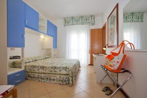 Postel nebo postele na pokoji v ubytování Hotel Fabris