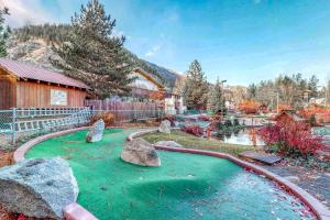 a garden with rocks in the middle of a pond at Icicle Village Resort 402: Juniper Studio in Leavenworth