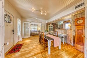 a dining room with a table and chairs at Cosmos Cottage in Fredericksburg +21 photos