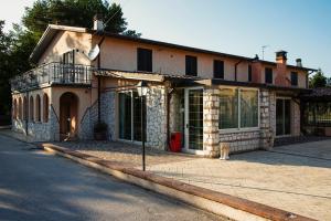 a house on a street with a fire hydrant in front of it at B&B IL FILO DI ARIANNA in LʼAquila