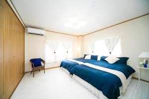 Postel nebo postele na pokoji v ubytování Awaji Seaside Resort in Shiduki1555