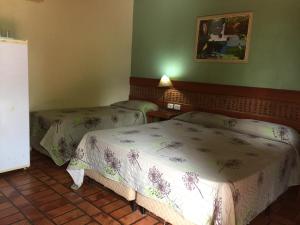 A bed or beds in a room at Fazenda San Francisco