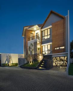 a rendering of a house at night at GAIA Lodge The Kusuma Hill Batu - Malang in Batu