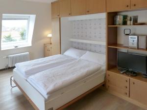 Ένα ή περισσότερα κρεβάτια σε δωμάτιο στο Haus Therese *FeWo 12*