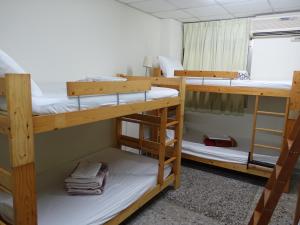 מיטה או מיטות בחדר ב-Kite Hostel