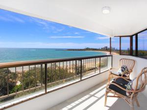 a balcony with two chairs and a view of the ocean at Parkyn Place 7 in Mooloolaba