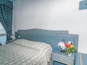 Postel nebo postele na pokoji v ubytování Hotel La Ninfea