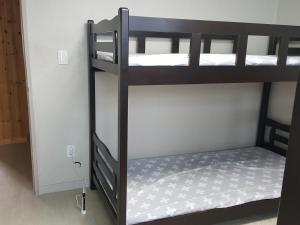 Postel nebo postele na pokoji v ubytování Guest House Manna