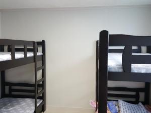 Postel nebo postele na pokoji v ubytování Guest House Manna