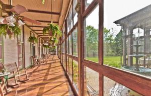 an empty porch of a house with windows at Southern Mansion in Cape May