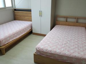 Postel nebo postele na pokoji v ubytování Guest House Manna