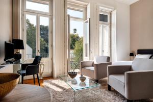 a living room with a couch and a table at Maison Cabral in Porto