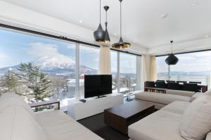 a living room with a view of a mountain at Kizuna in Niseko