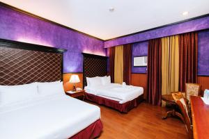 Ένα ή περισσότερα κρεβάτια σε δωμάτιο στο Hotel San Marco