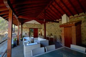 a house with a swimming pool and a patio at To Kastri in Kalopanayiotis