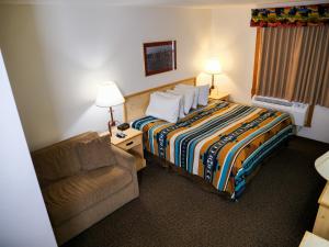 Postel nebo postele na pokoji v ubytování Range Country Lodging