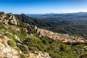 a view of a town on a mountain at Hotel Bia Maore in Baunei