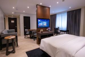 TV a/nebo společenská místnost v ubytování Coro Hotel
