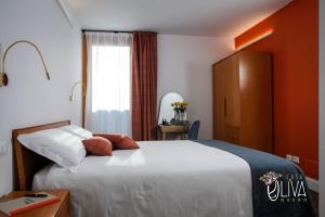 Postel nebo postele na pokoji v ubytování Casa Oliva Quero