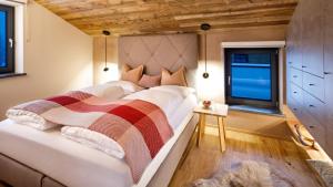 Postel nebo postele na pokoji v ubytování Katschberg Lodge
