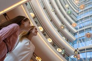 two girls looking at a ceiling in a building at Jumeirah Beach Hotel Dubai in Dubai